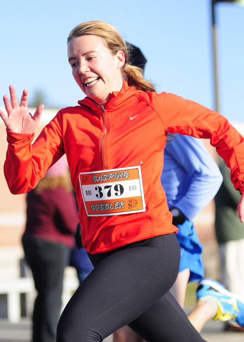 WOMEN’S WINNER: Anna Ackerman was the first female finisher at the Gasping Gobbler 5k run which began and finished at Cony High on Thursday November 28, 2013 in Augusta. There were over 400 registrants in the event that gave turkeys and other Thanksgiving dinner groceries as prizes.