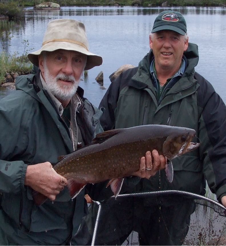BIG CATCH: Carroll Ware, left, of Skowhegan holds up a 10-pound brook trout he caught recently. Ware holds 31 certified fishing world records and would like push that number to 50.