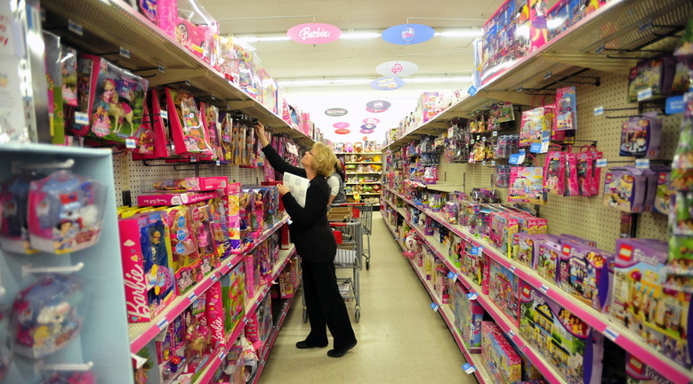 BLACK FRIDAY: Laurie Brown, assistant manager of the Waterville Kmart, marks prices down in the toy department during the Black Friday sales in Waterville on Friday morning.