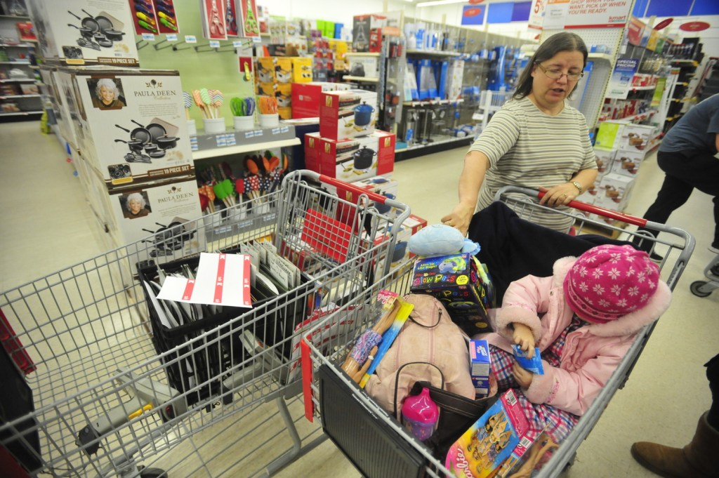 BLACK FRIDAY: Karla Schieferstein shops with her granddaughter Natalie Feris, 3, both of Fairfield, to take advantage of the Black Friday sales at Kmart in Waterville early Friday morning.