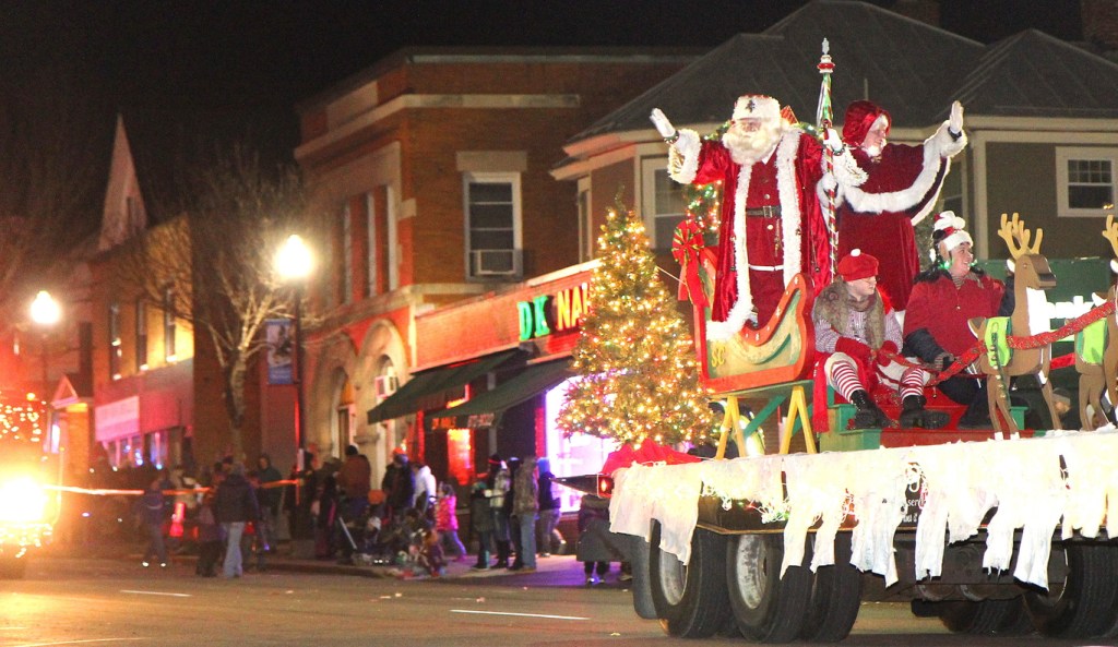 Photo by Jeff Pouland HERE COMES SANTA: Santa and Mrs. Claus wave to the crowd during the 8th annual Parade of Lights and opening of Kringleville on Friday night in downtown Waterville. Photo by Jeff Pouland HERE COMES SANTA: Santa and Mrs. Claus wave to the crowd during the 8th annual Parade of Lights and opening of Kringleville on Friday night in downtown Waterville.