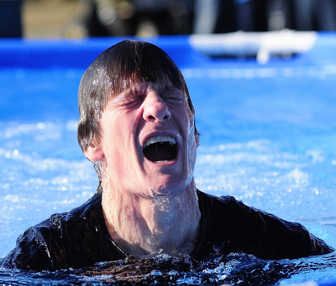 Bracing: Brian Shea reacts after popping out of the pool at the Polar Bear Plunge fundraiser for Bicentennial Nature Park on Saturday at Old Fort Western in Augusta.