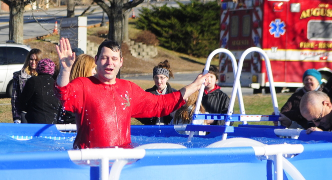 Enough of this: Tobias Parkhurst climbs out of the pool Saturday at the Polar Bear Plunge fundraiser at Old Fort Western in Augusta. The proceeds are meant to support the city’s Bicentennial Nature Park.
