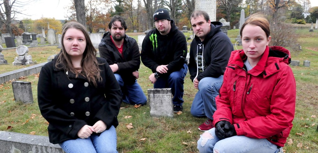 SPIRITED: Members of Paranormal Research and Extermination assemble at the Edward E. Mathew gravesite at Pine Grove Cemetery in Waterville recently. The group is trying to record the spirit of Mathews, who was the first murder victim in Waterville in 1847. From left are Naomi and Kris Robinson, Jim Easler, Chris Clarke and Allie Turner.