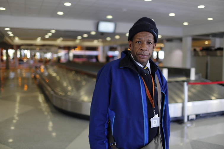 John Stewart works at the Philadelphia International Airport, escorting people in wheelchairs. He is paid $5.25 an hour, plus tips, and worries about paying his bills and losing his job.