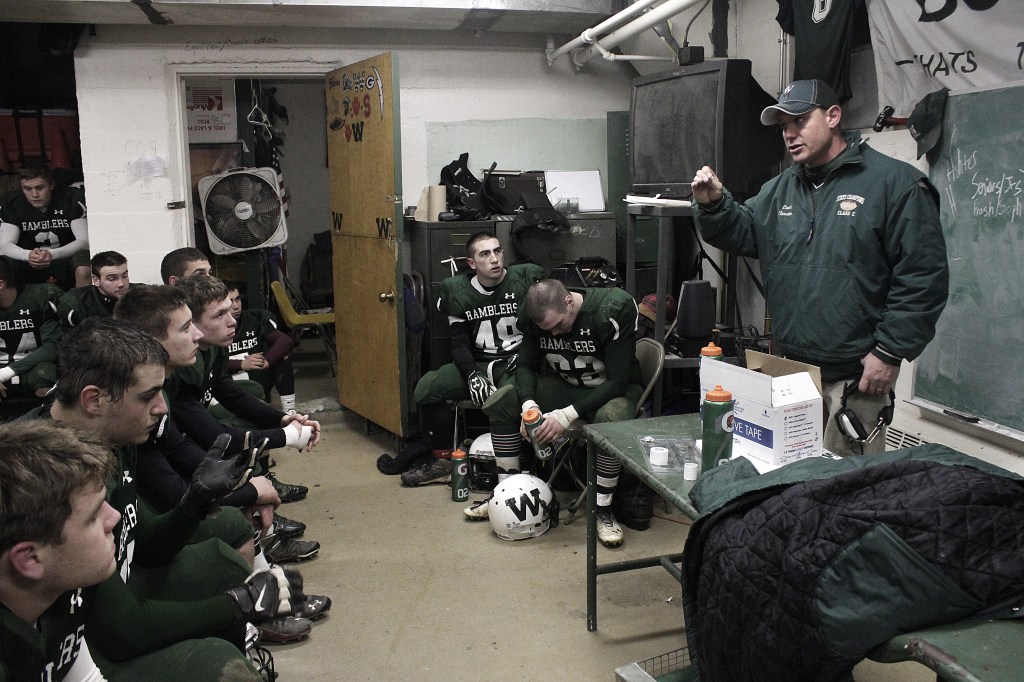 LEADING THE WAY: Winthrop-Monmouth coach Joel Stoneton talks to the Ramblers at halftime of their campbell Conference playoff game against Dirigo earlier this month. Stoneton, the head coach of the Winthrop High School football team for eight season, had a new challenge in his ninth as a head coach: Bring athletes from two communities together on one high school team.