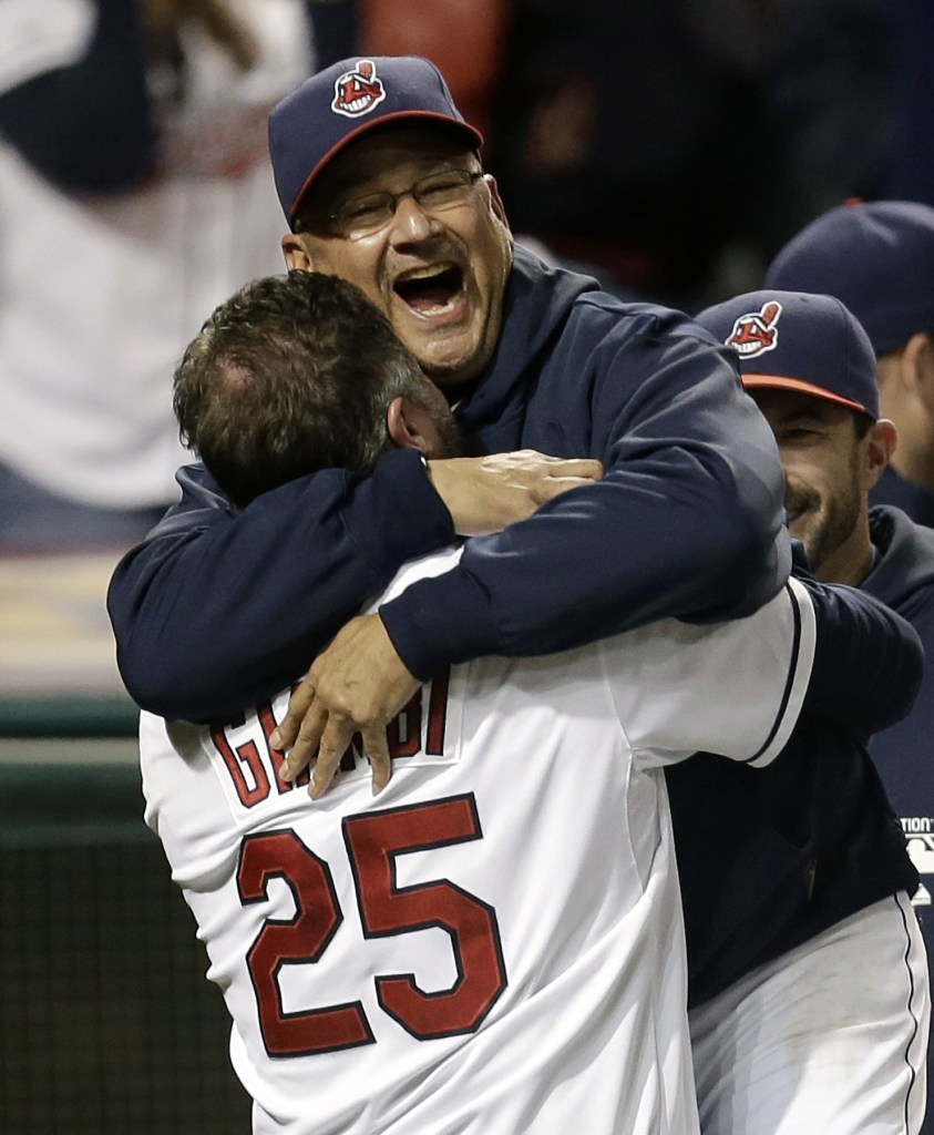 In this Sept. 24, 2013, file photo, Cleveland Indians designated hitter Jason Giambi, left, picks up manager Terry Francona after Giambi hit a two-run home run off Chicago White Sox relief pitcher Addison Reed in the ninth inning of a baseball game in Cleveland. Francona was selected as the AL Manager of the Year on Tuesday, Nov. 12, 2013, by the Baseball Writers’ Association of America.