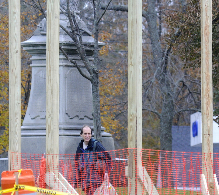 GOING UP: Steve Jordan inspects the beams Thursday of the new gazebo that’s being erected at the Gardiner Common.