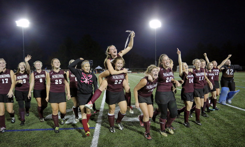 WE WON: Nokomis celebrates its 1-0 victory over York in the Class B field hockey state championship Saturday at Yarmouth High School.