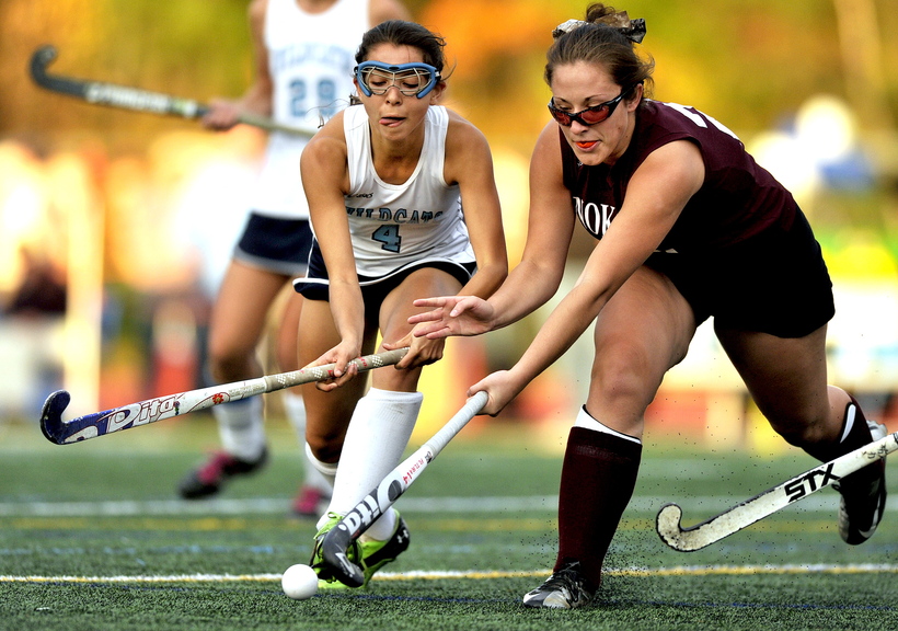BATTLE FOR THE BALL: York’s Kayle Kelly, left, competes for the ball with Mikayla Charters of Nokomis, right, uring the Class B field hockey championship game Saturday at Yarmouth High School.