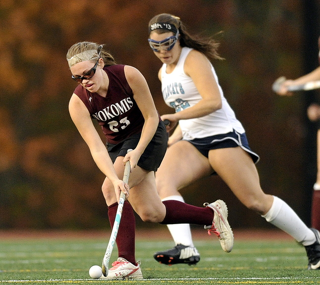 ON THE MOVE: Taylor Shaw of Nokomis moves with the ball in front of York’s Madeline Leroux during first half action in the Class B field hockey championship game Saturday at Yarmouth High School.