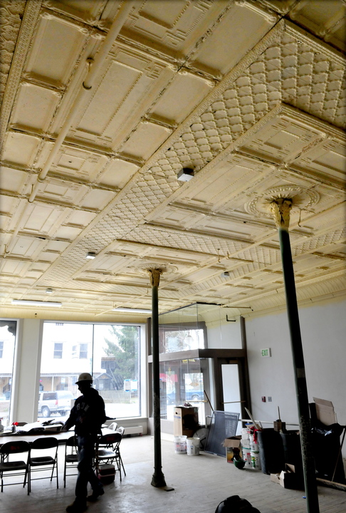 HISTORIC: Contractor Randy Woodworth works inside a room where original tin ceiling panels were restored and replaced inside the Gerald Hotel in Fairfield.