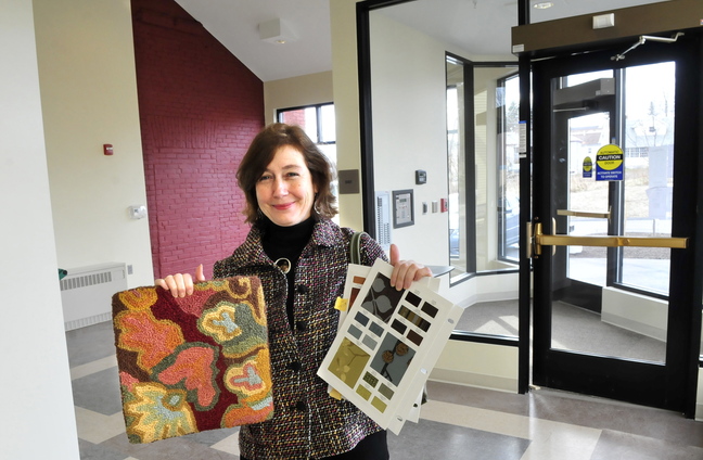 NEW LOOK: Interior designer Lori Larochelle stands in the new entrance to the Gerald Hotel in Fairfield holding examples of carpet and fabric that will be used in the entry.
