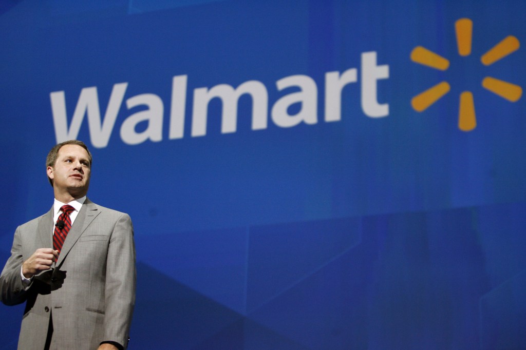 Doug McMillon speaks at the Walmart shareholders meeting in Fayetteville, Ark., in this June 7 photo. The discount chain has alienated some U.S. shoppers because it doesn’t have enough workers to keep shelves adequately stocked, leading some consumers to decamp to smaller-format stores that offer merchandise starting at $1.