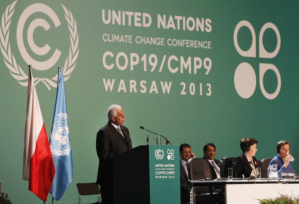 Qatar’s Abdullah Bin Hamad Al-Attiyah,left, addresses delegates during the opening session of the United Nations Climate Change Conference COP19 in Warsaw, Poland, Monday, Nov. 11, 2013. Thousands of participants from nations and environment organizations from around the world have opened two weeks of U.N. climate talks that are to lay the groundwork for a new pact to prevent global warming. (AP Photo/Czarek Sokolowski)