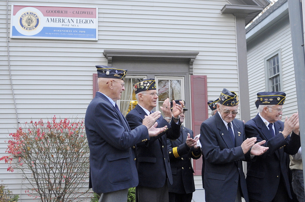 Celebration: Members of Hallowell’s American-Legion Post applaud members of Boy and Girl Scout packs that helped prepare a free breakfast for veterans Monday morning at the Post. The veterans and scouts went to the Hallowell Cemetery following the breakfast for a Veterans Day ceremony.