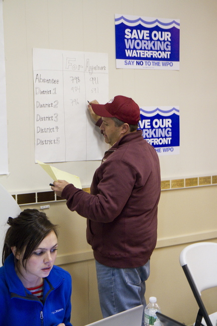 Working Waterfront Coalition campaign manager Dan Demeritt tallies poll results.