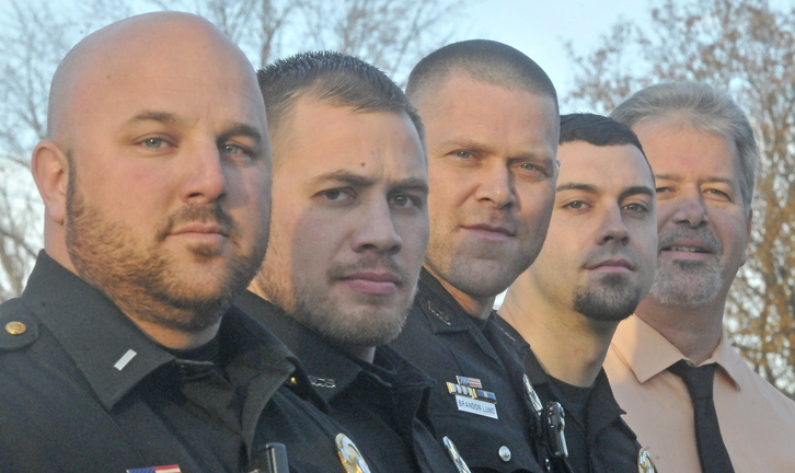 NO SHAVE NOVEMBER: Winslow Police Department's from left to right, Lt. Josh Veilleux, Ron McGowen, Brandon Lund, Haley Fleming and Chief Jeffrey Fenlason, show off their stubble as they participate in "no shave November" to raise money for the Barbara Bush Childrens Home.