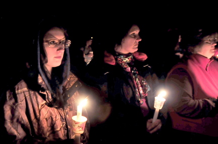 FRIEND: Sherissa McLaughlin, left, of Moscow and her mother Sherry, center, attended a candlelight vigil for her friend Jillian Jones in Bingham on Sunday. Jones, who was killed last week in Augusta, grew up in the area. McLaughlin described Jones as a likeable and fun person.