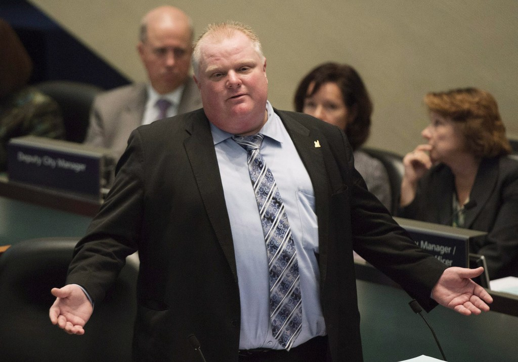 Mayor Rob Ford talks during a City Council debate in Toronto on Wednesday, Nov. 13, 2013. Toronto Mayor Rob Ford admitted Wednesday that he bought illegal drugs in the past two years and that he will not step down.