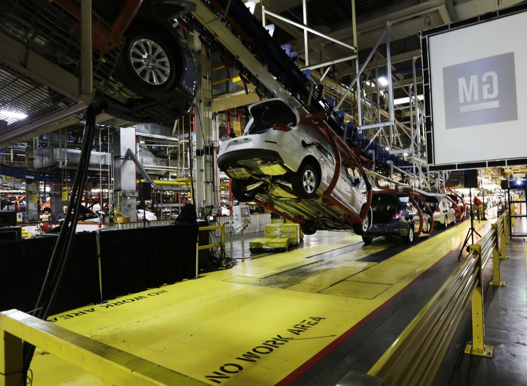 In this Monday, Jan. 28, 2013 file photo, cars move along an assembly line at the General Motors Fairfax plant in Kansas City, Kan. The U.S. government expects to sell the last of its stake in General Motors by the end of 2013, bringing an end to a sad chapter in the 105-year-old auto giantís history.