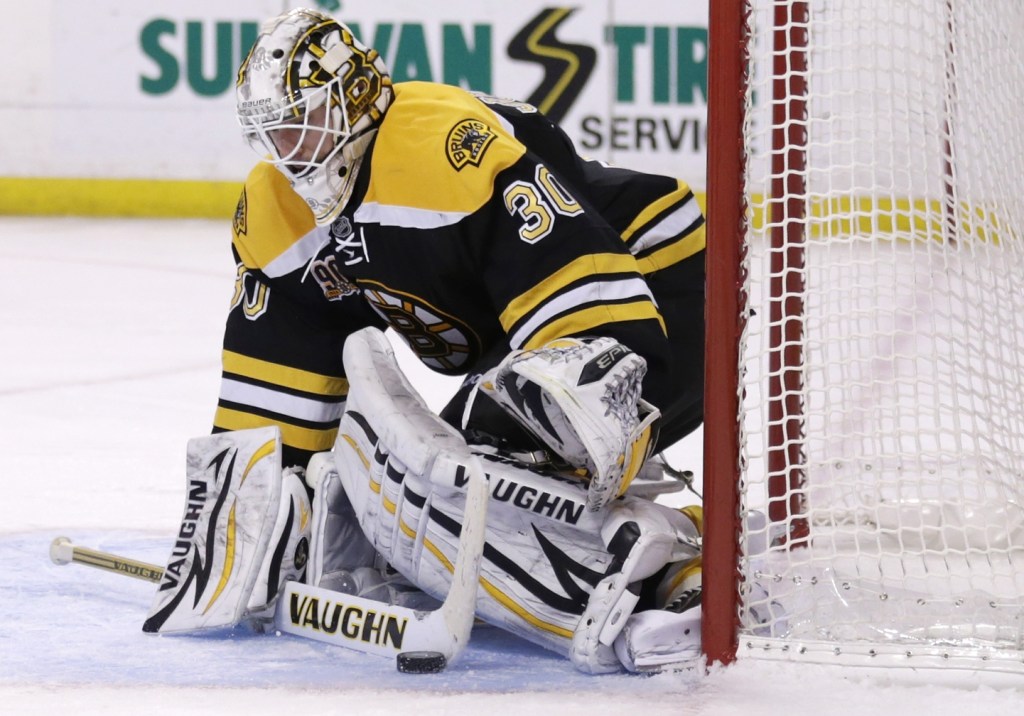 Boston Bruins goalie Chad Johnson (30) makes a stick save against the Columbus Blue Jackets during the third period of an NHL hockey game, in Boston, Thursday, Nov. 14, 2013. The Bruins won 3-2 in overtime. (AP Photo/Charles Krupa)