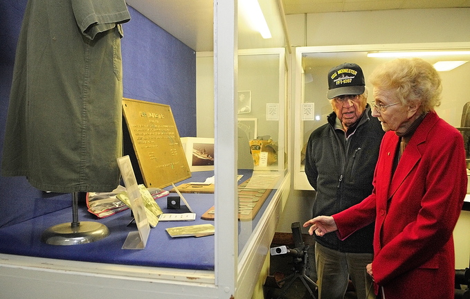 Reunion: Michael Tatosian, of Lewiston, talks to Gertrude Moinester as they look at a display during a tour of the Maine Military Historical Society Museum recently in Augusta. Tatosian and Moinester’s late son served in the Navy together in Vietnam.