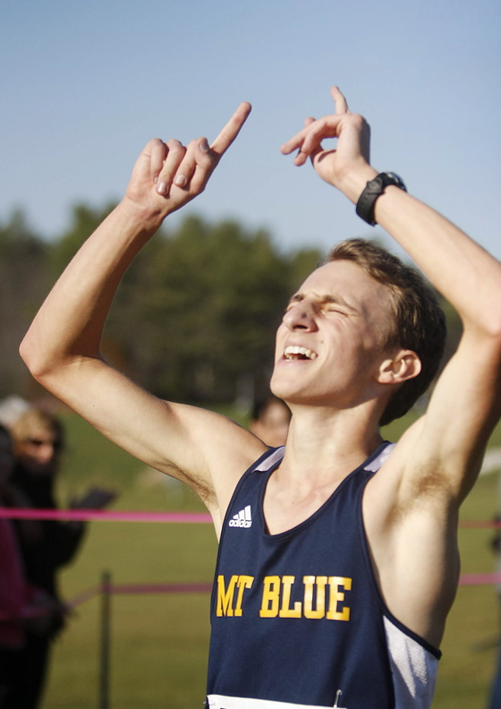 BIG DAY: Mt. Blue High School’s Josh Horne celebrates after winning the Class A cross country state championship on Saturday at Twin Brooks Recreation Area in Cumberland.
