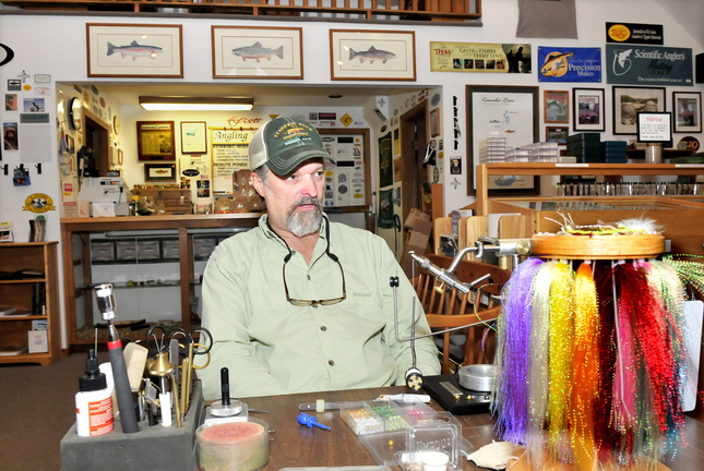 Staff photo by David Leaming FISH DECLINE: Bob Mallard, owner of Kennebec River Outfitters in Madison, speaks recently about the decline in trout fishing on the nearby Kennebec River and the negative impact on his business.