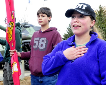 CONTINUED SUPPORT: U.S. Army veteran Emily Childs of China speaks on why she turned out for Veterans Day in Waterville on Monday, Nov. 11, 2013. At left is her son Scott.
