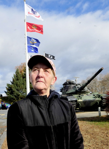 Honoring: Sandra Ouellette of Sidney expresses why she supports and walked in a Veterans Day march on Monday, nov. 11, 2013.