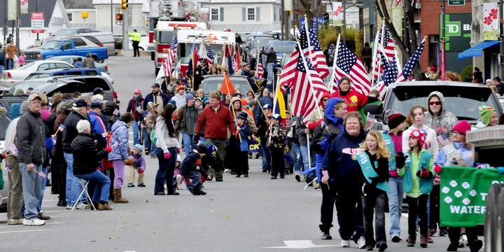 TRIBUTE: Participants in the Veterans Day parade make their way down Main Street in Waterville on Monday, Nov.11, 2013.