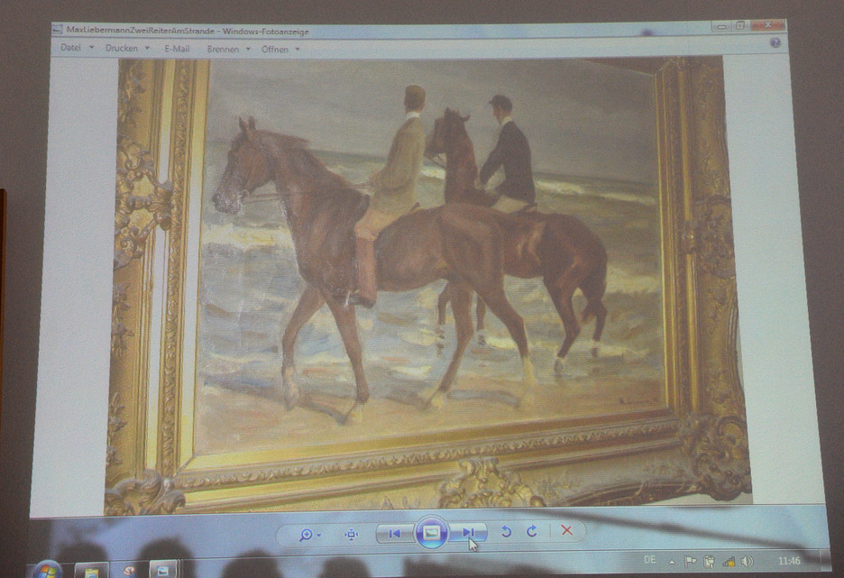 A painting by Max Liebermann “Zwei Reiter am Strande” (“Two riders on the beach”) is projected on a screen during a news conference in Augsburg, Germany, Tuesday.