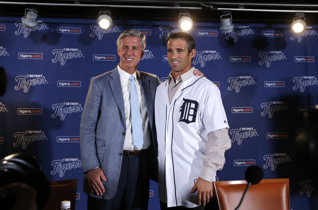 Detroit Tigers general manager David Dombrowski, left, introduces Brad Ausmus as the new Detroit Tigers manager during a news conference in Detroit Sunday, Nov. 3, 2013. Ausmus replaces Jim Leyland who stepped down as manager.