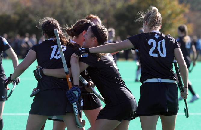 Bowdoin celebrates its fourth and final goal against Christopher Newport University with just over a minute left on the clock during the NCAA Divison III semi-finals in Virginia Beach, Va. Scoring the goal was Rachel Kennedy (18), far left. Congratulating Kennedy is Adrienne O’Donnell (5), middle, and Pam Herter (20), right. Bowdoin won 4-1.