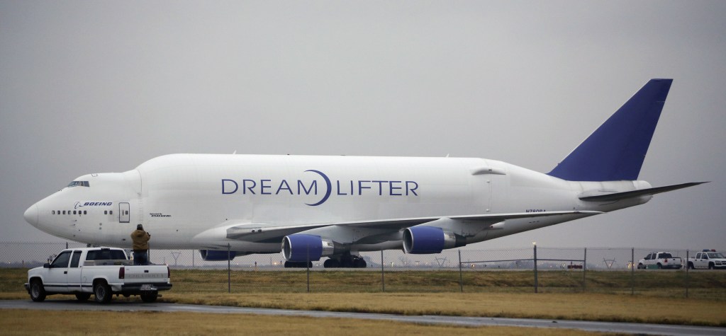 A man takes a photo of the Boeing 747 LCF Dreamlifter from the back of his truck Thursday, after the aircraft accidentally landed at Col. James Jabara Airport in Wichita, Kan. Wednesday night. Boeing says the Dreamlifter, a 747 jumbo jet used to haul parts for construction of its new 787 Dreamliner, landed safely at Jabara, about nine miles from McConnell Air Force Base in Wichita where it was supposed to land.