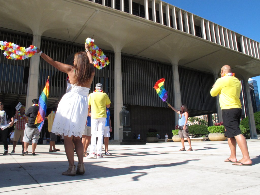 Gay marriage supporters rally outside the Hawaii Capitol in Honolulu ahead of a Senate vote on whether to legalize same-sex marriage on Tuesday.