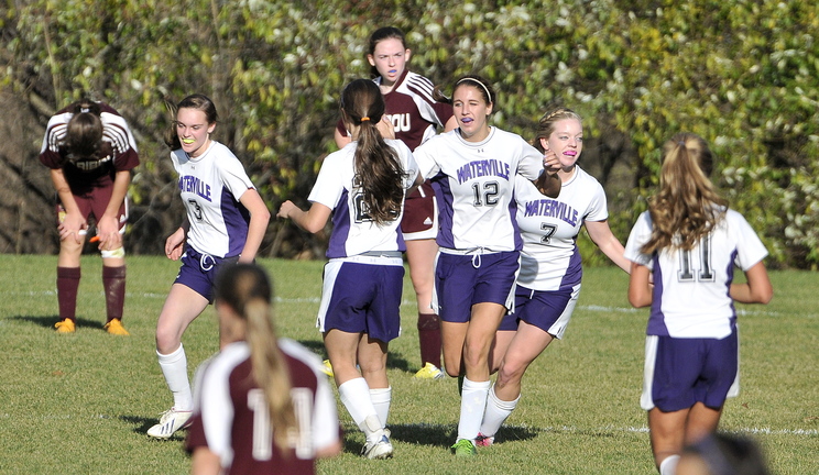 CELEBRATE: Waterville Senior High School celebrates a second half goal against Caribou High School during the Panthers’ 6-0 win in the Eastern B semifinals Saturday in Waterville.