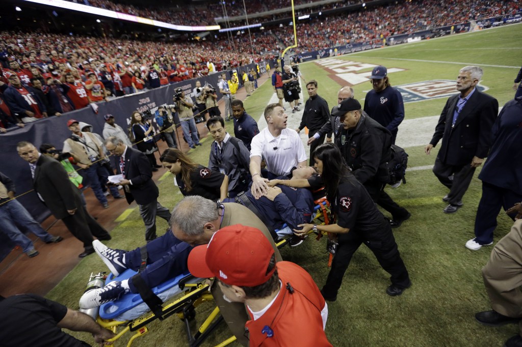 Houston Texans head coach Gary Kubiak is taken off the field on a stretcher during the second quarter of an NFL football game against the Indianapolis Colts, Sunday, in Houston.