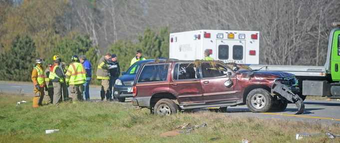 Crash scene: Rescue officials gather at the scene of a multi-car accident in Palmyra on the southbound section of Interstate 95 on Monday.