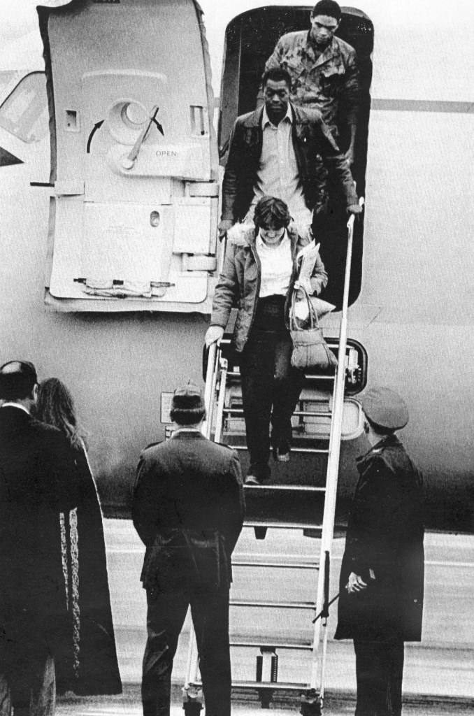 In this July 20, 1979, photo, the first three hostages released from the U.S. Embassy in Tehran, arrive at Rhein-Main U.S. Air Force base in Germany. From the top of the steps are Marine Sgt. William Quarles, Marine Cpl. Ladell Maples and Kathy Gross.