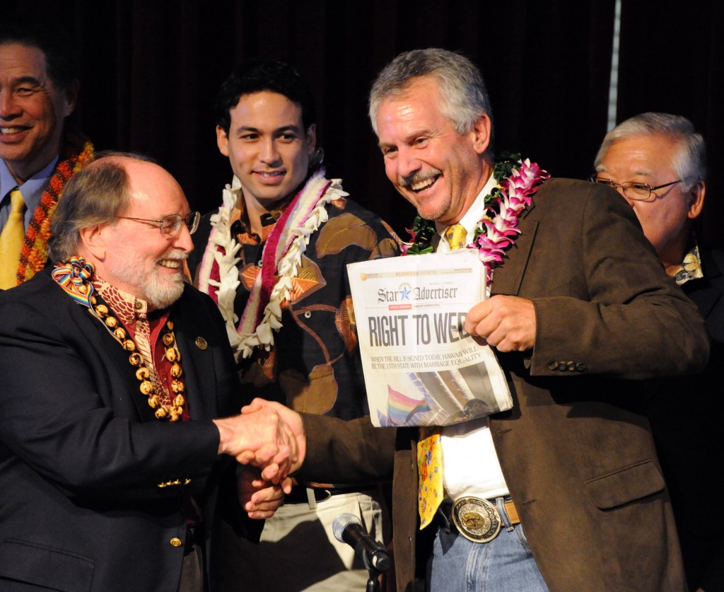 Gov. Neil Abercrombie, left, and former Sen. Avery Chumley celebrate after Abercrombie signed a bill legalizing gay marriage in Hawaii on Wednesday in Honolulu.