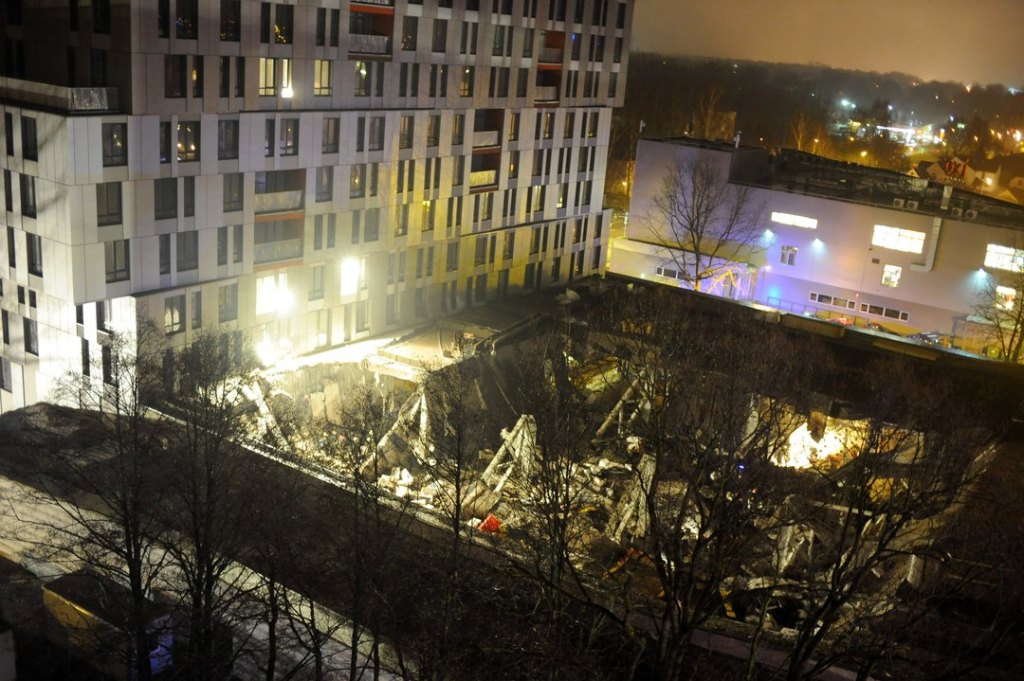 A lview of the collapsed Maxima supermarket in Riga, Latvia, late Thursday.Rescue workers periodically turned off all equipment and asked relatives of missing people to call so that they can pinpoint ringing phones, rescue service spokeswoman Viktorija Sembele said.