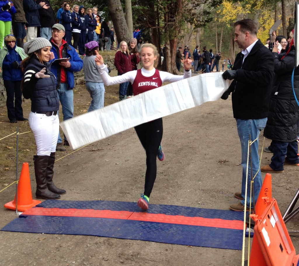 WINNING THE RACE: Kents Hill sophomore Anne McKee cross the finish line to win the Division 4 New England prep school cross country meet recently in Thompson, Conn.