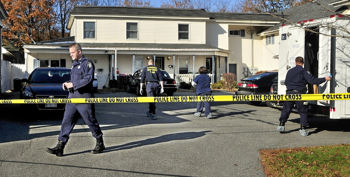 Investigators continue work at the scene of a suspicious death on Thursday at 32 Crosby St. in Augusta
