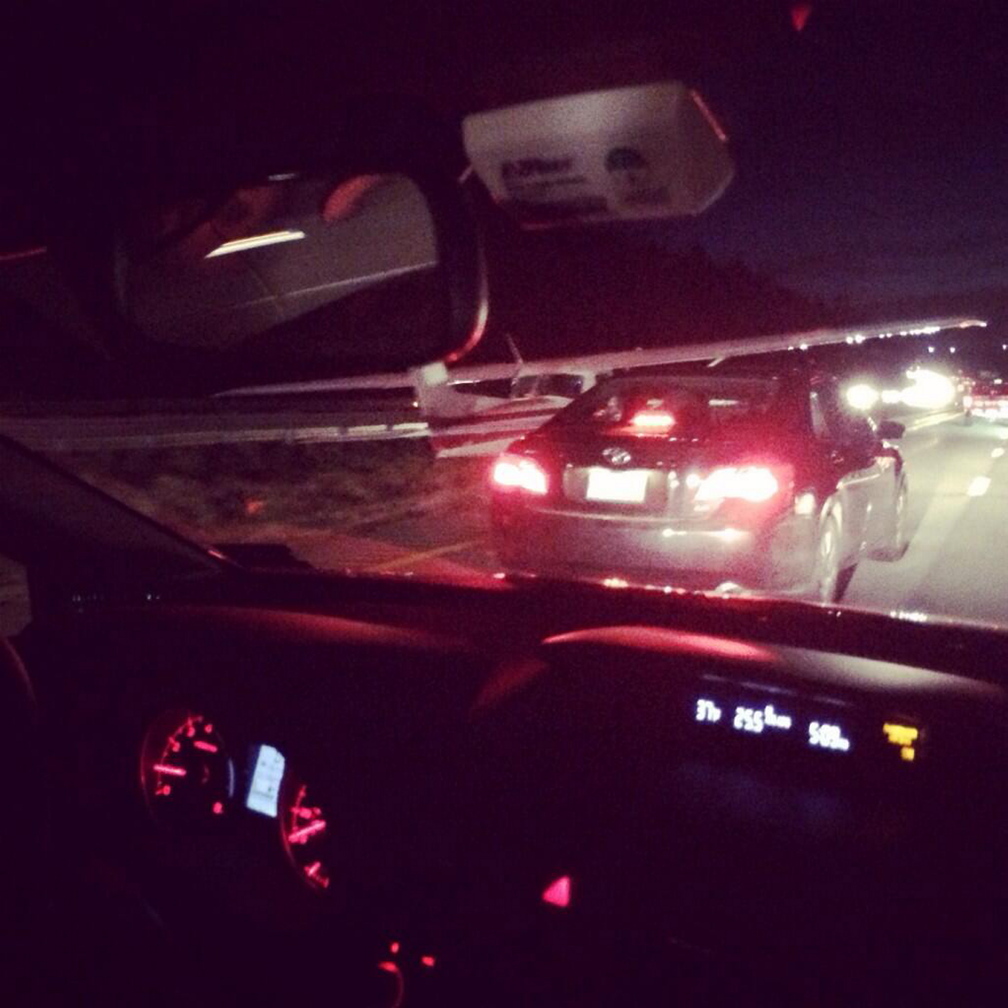 A commuter took this photo from his vehicle on Interstate 295 showing a plane at left after it made an emergency landing on the highway Thursday evening.