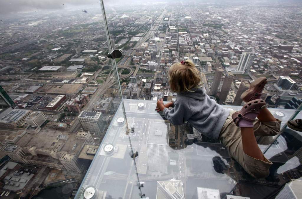 The view of Chicago from “The Ledge,” at the 110 story, 1,450 foot Willis Tower. The glass balcony is suspended 1,353 feet in the air and juts out 4 feet from the Sears Tower’s 103rd floor Skydeck. Associated Press