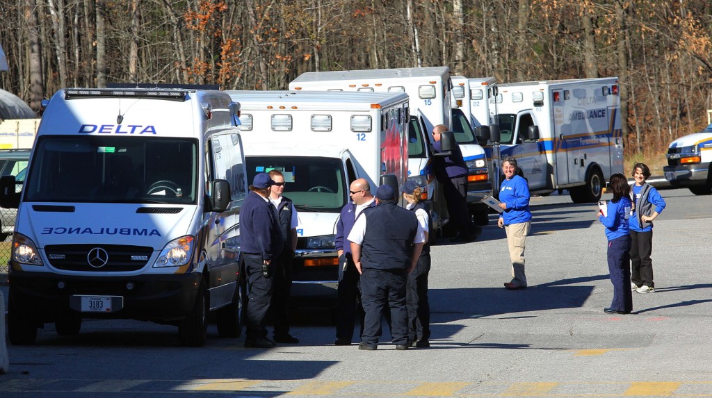 Photo by Jeff Pouland ABOUT TO MOVE: Ambulance crews wait to receive patients outside the Thayer Center for Health in Waterville on Saturday before transporting them to the new Alfond Center for Health in Augusta. The Thayer Center for Health will remain open as an outpatient facility with a 24-hour emergency department.