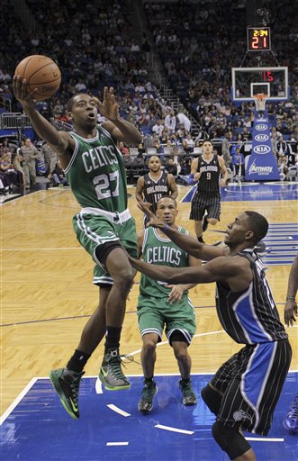 Boston Celtics' Jordan Crawford (27) gets off a shot over Orlando Magic's Maurice Harkless, right, during the second half of an NBA basketball game in Orlando, Fla., Friday, Nov. 8, 2013. Boston Celtics won the game 91-89.