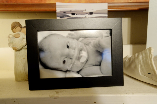 A photograph of Charlie sits on the mantel of the family’s home in South Portland.